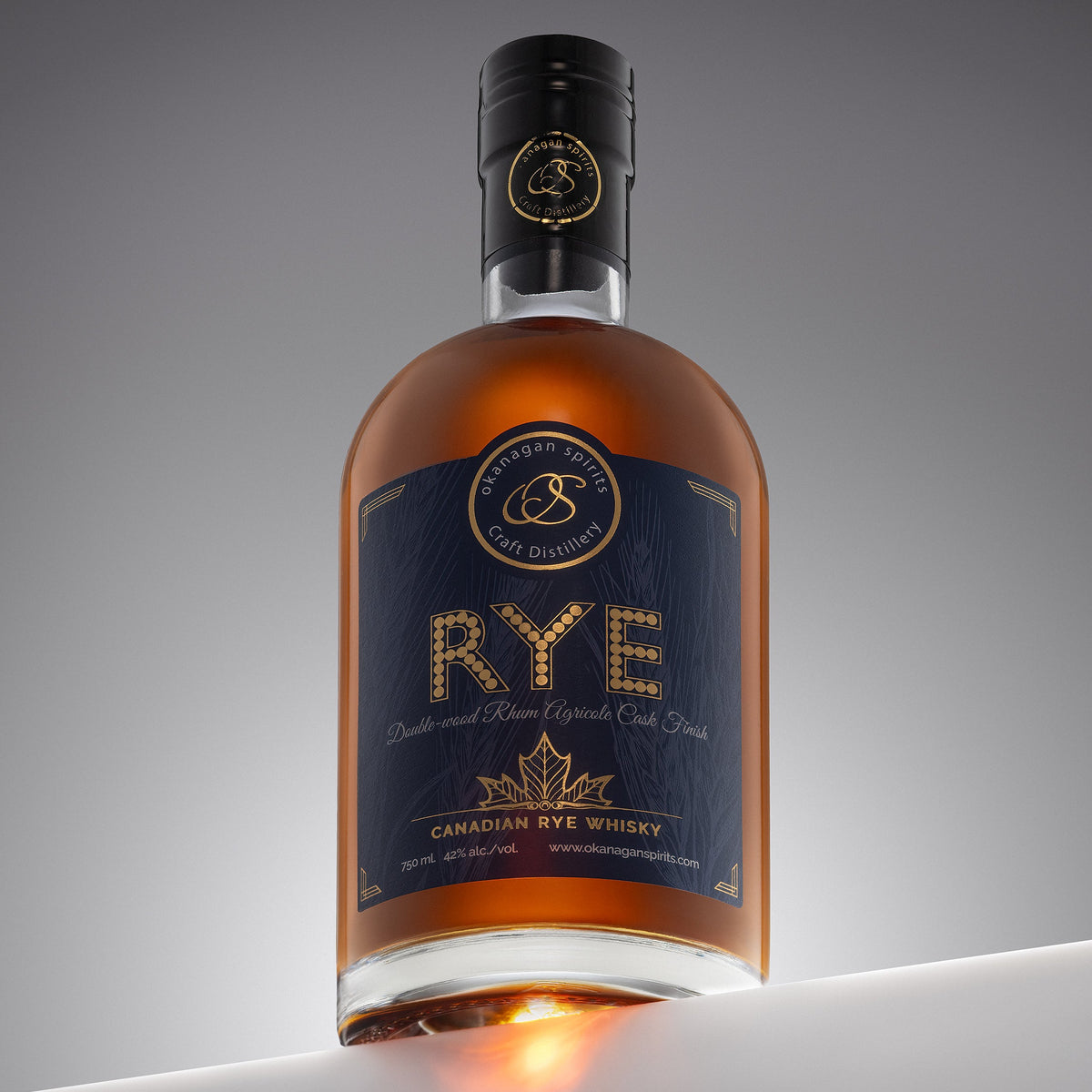 Bottle of Canadian rye whiskey with a dark label on a gray background