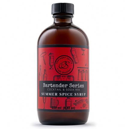A glass bottle of Bartender Series Summer Spice Syrup with a black cap and a red label, shown on a white background.